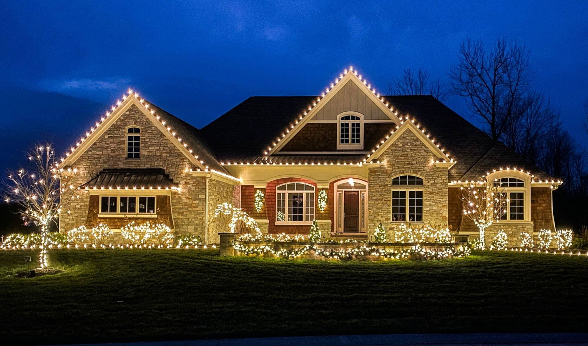Christmas light installation on a Fresno, CA home roofline